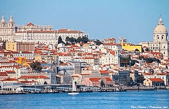 Lisbon's vibrant skyline featuring colorful buildings, historic architecture, and a serene waterfront, illustrating the city's unique charm and cultural heritage.